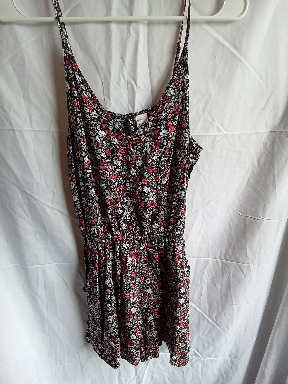 Divided Black Floral Spaghetti-Strap Romper with Red and White Accents